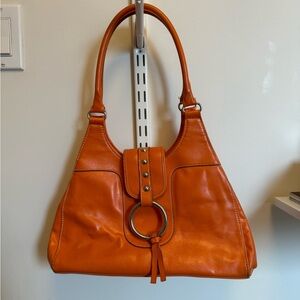 Bold Orange Purse with Silver Ring Detail – Spacious & Stylish
